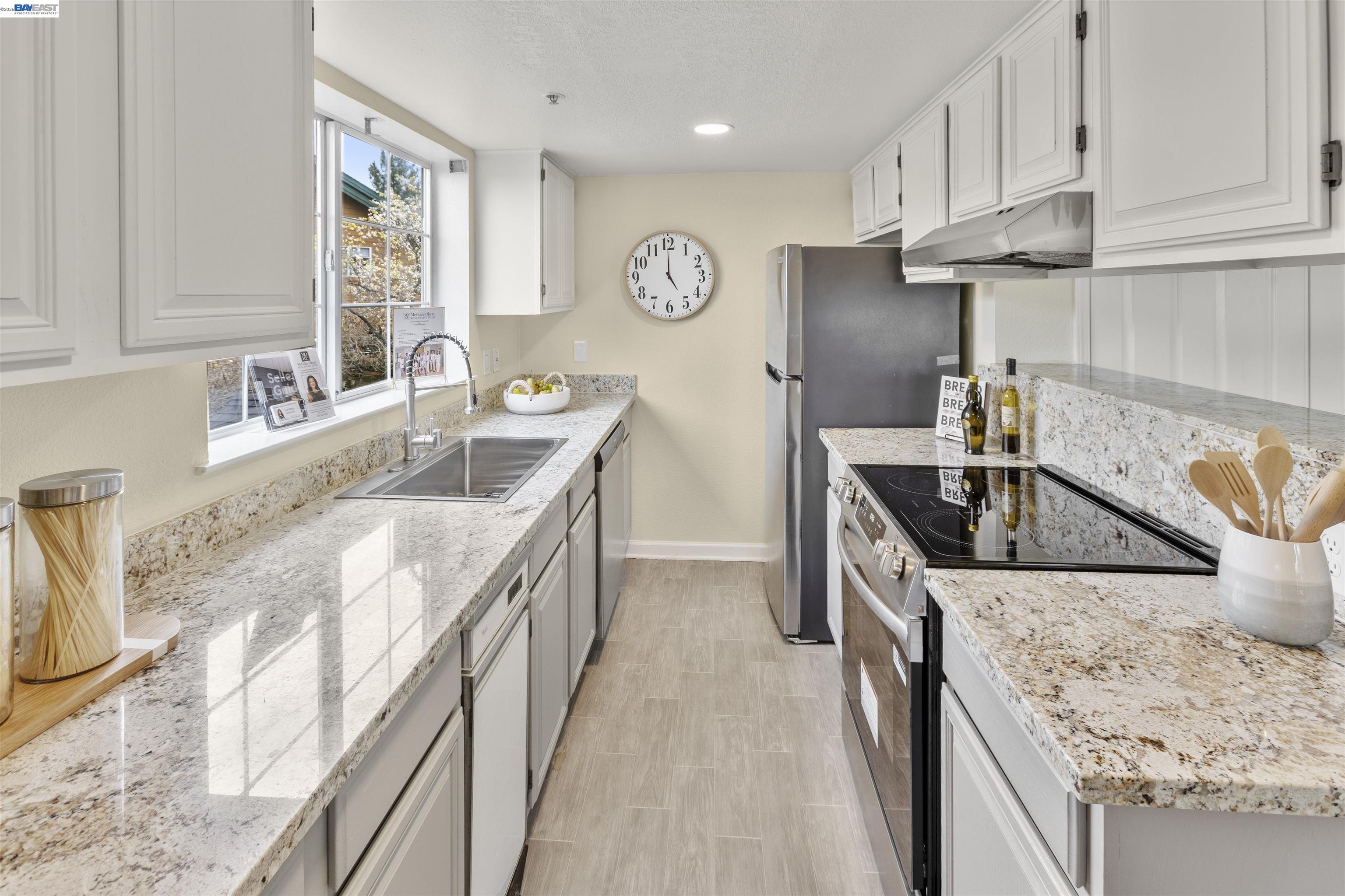 113 Stone Pine Lane San Ramon, CA 94583 - Photo 16 of 31 a kitchen with stainless steel appliances granite countertop a sink stove and refrigerator