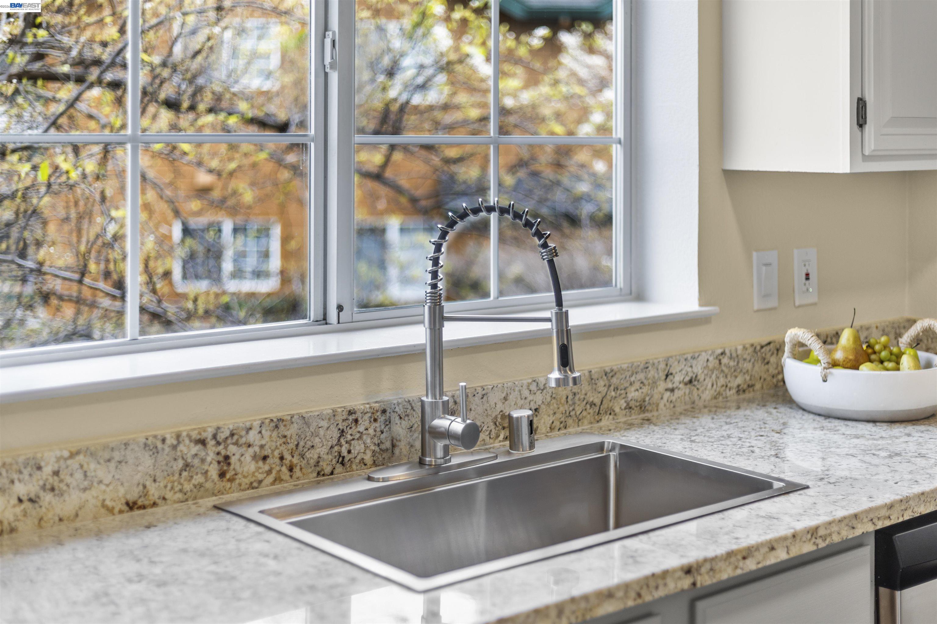 113 Stone Pine Lane San Ramon, CA 94583 - Photo 18 of 31 a kitchen with a sink and a window