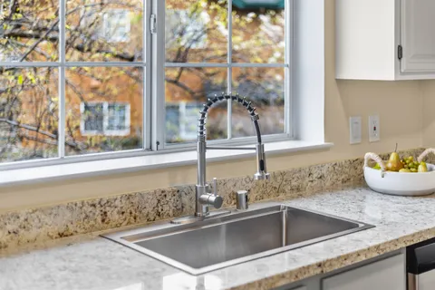 a kitchen with a sink and a window
