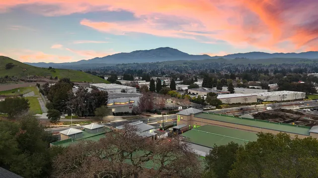 a view of a town with mountains in the background