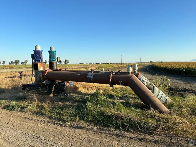 a view of a lake with a car parked