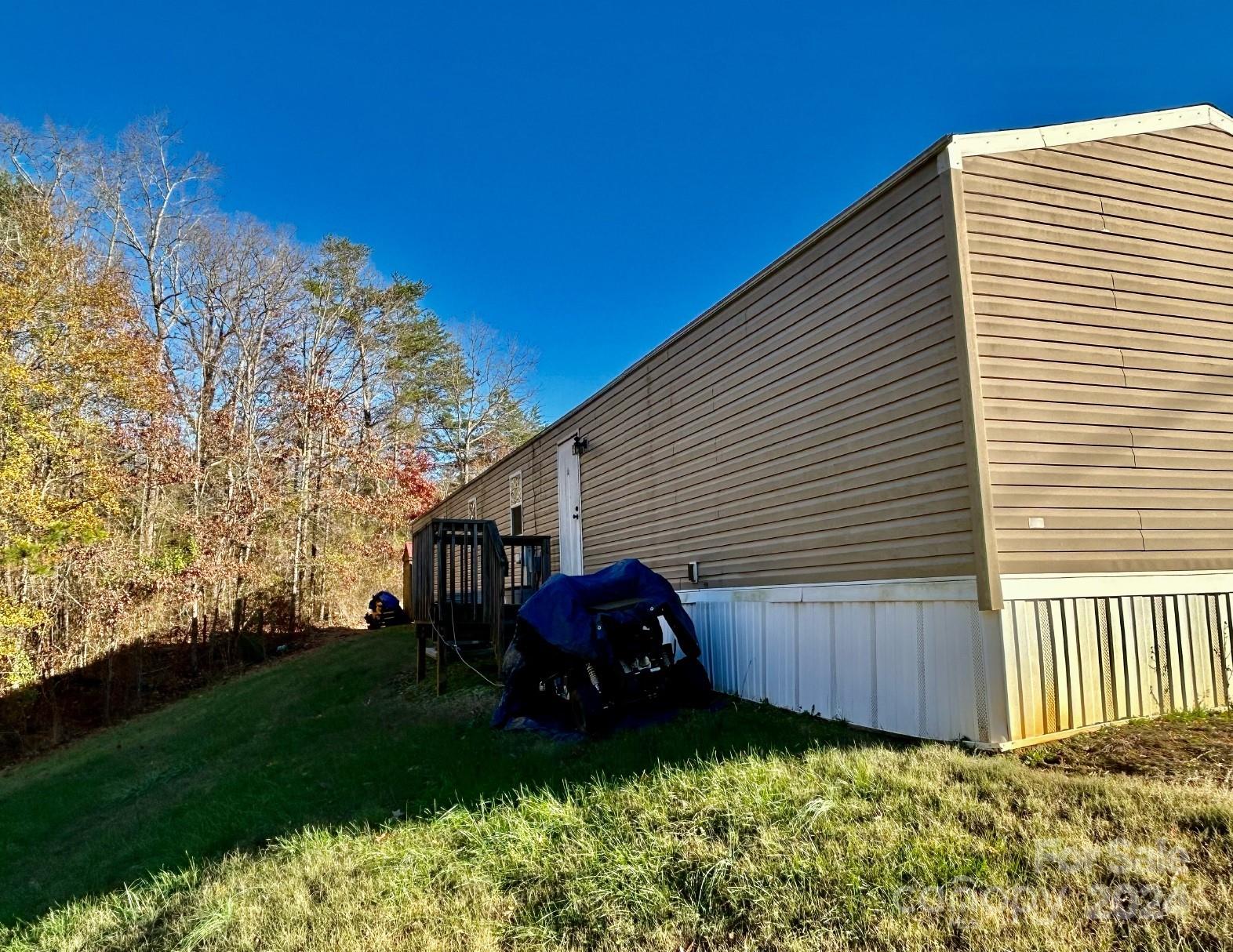 7486 Buff Allen Road Hickory, NC 28602 - Photo 12 of 13 a view of backyard with deck and garden