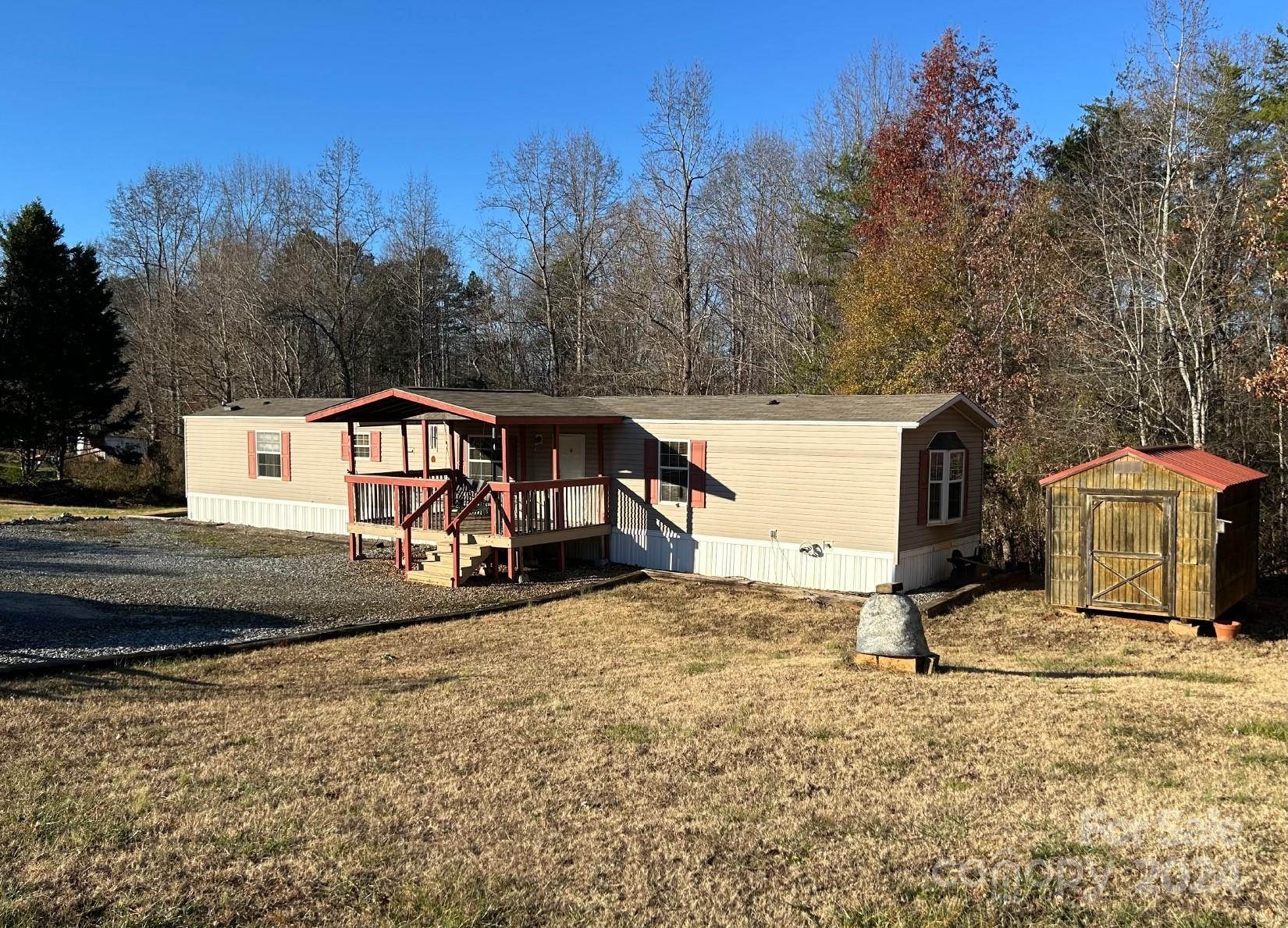 7486 Buff Allen Road Hickory, NC 28602 - Photo 2 of 13 a view of a house with a yard covered in snow