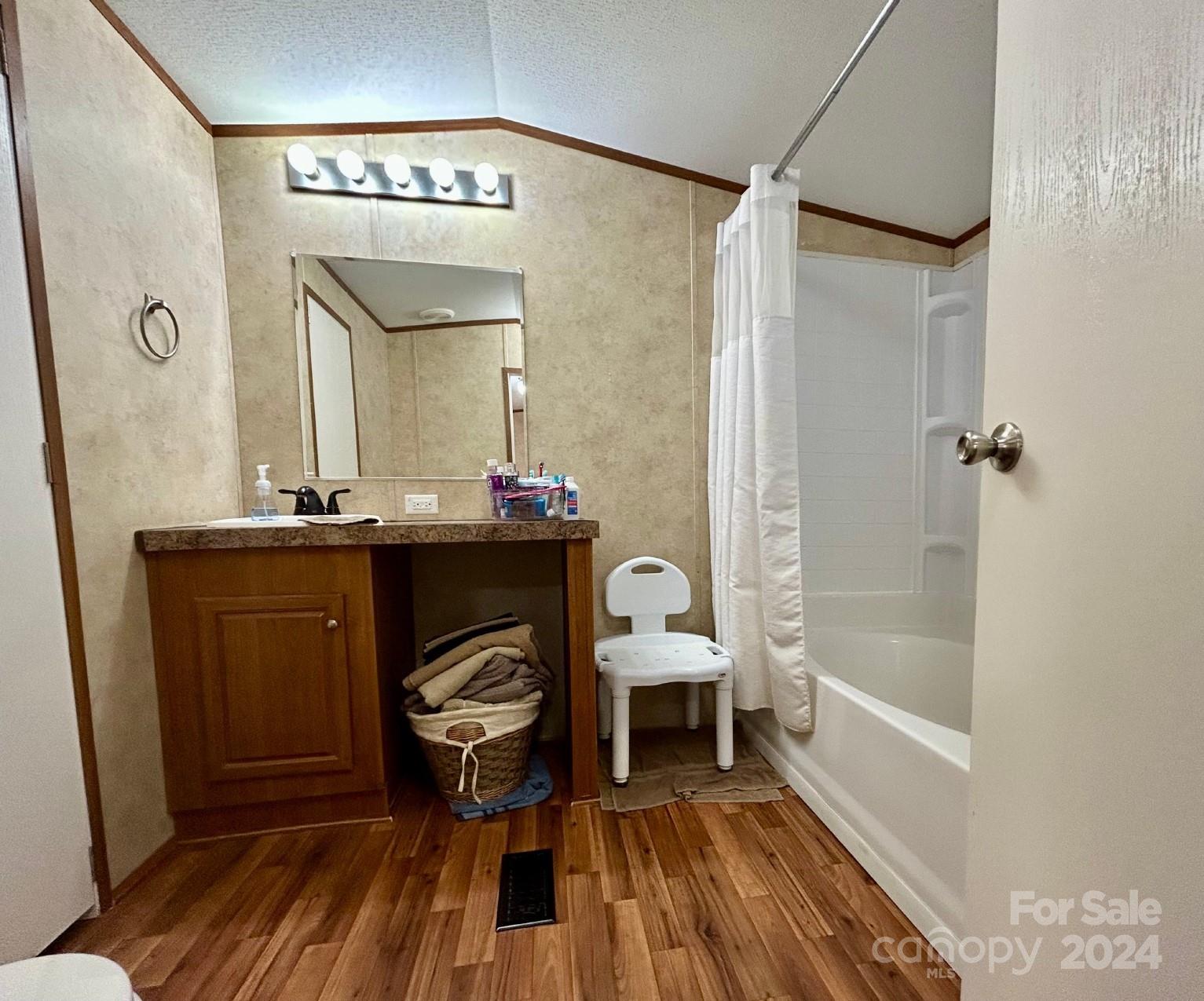 7486 Buff Allen Road Hickory, NC 28602 - Photo 6 of 13 a en suite bathroom with a sink and a mirror