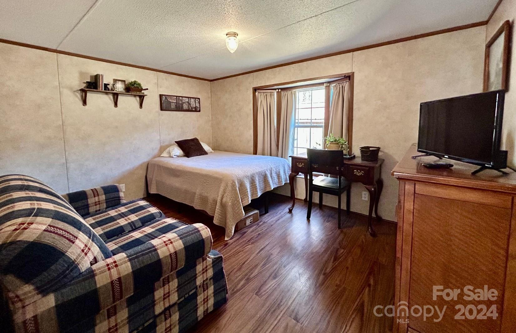 7486 Buff Allen Road Hickory, NC 28602 - Photo 9 of 13 a bedroom with two beds and a flat screen tv