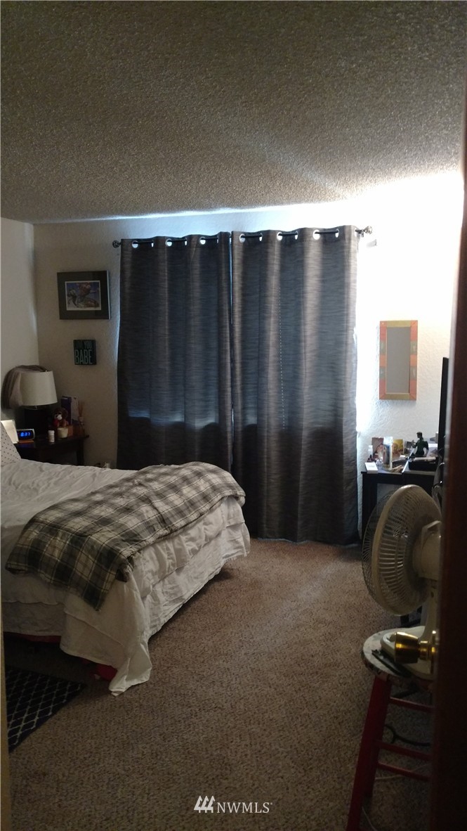817 North 4th Street Renton, WA 98057 - Photo 3 of 7 a bedroom with a bed and a closet