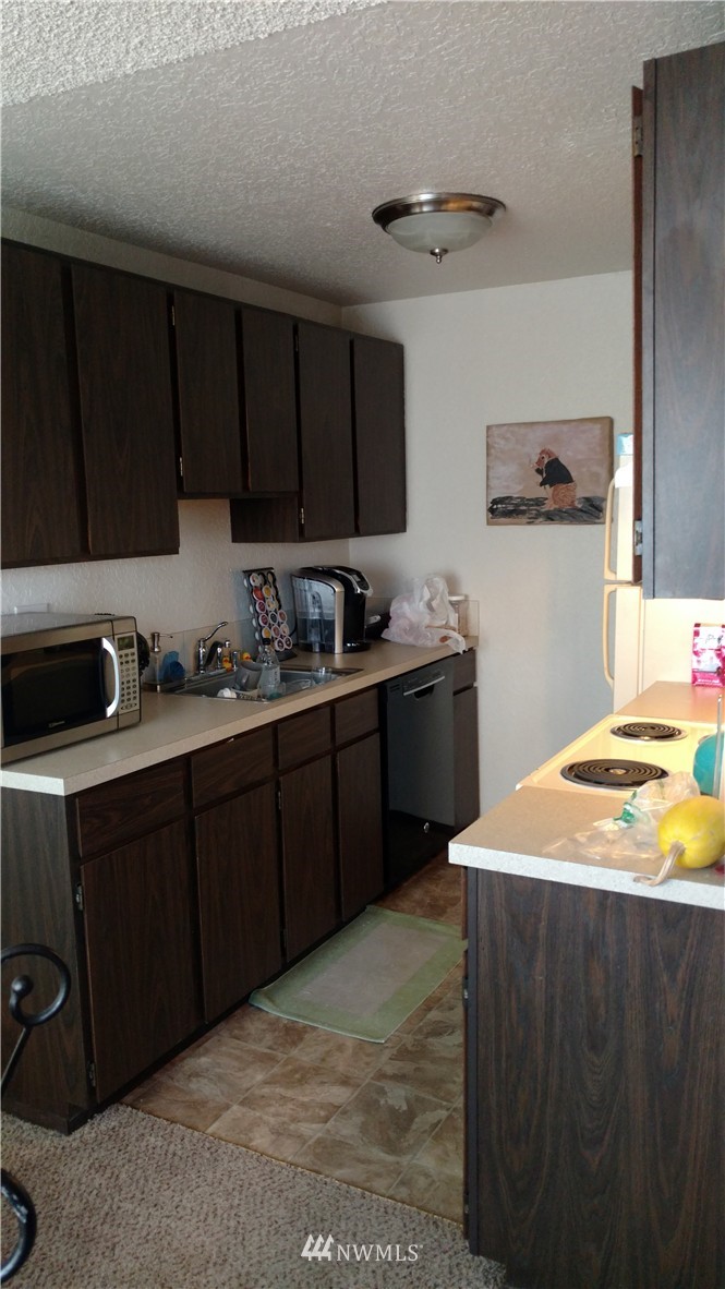 817 North 4th Street Renton, WA 98057 - Photo 4 of 7 a kitchen with a sink and cabinets