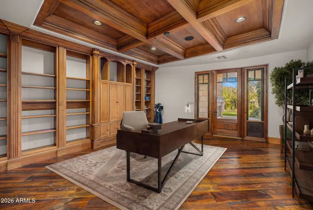 a living room with a fireplace with wooden floor