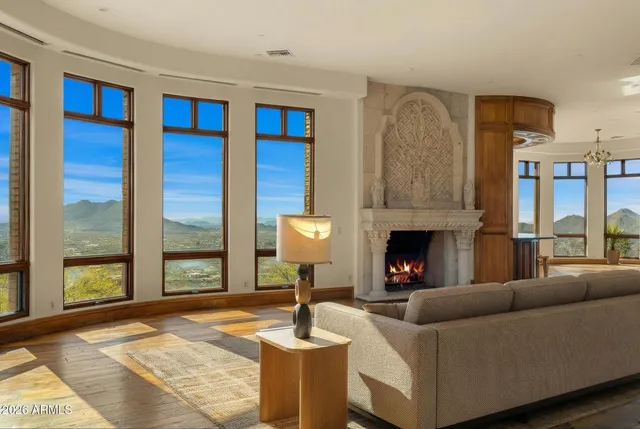 a spacious bedroom with a bed and a large window