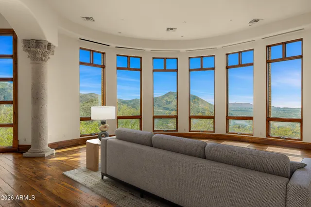 a bathroom with a granite countertop sink a mirror and a shower