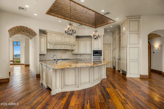 a view of a patio with table and chairs potted plants