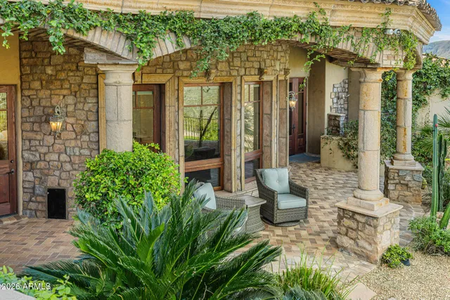a bathroom with a granite countertop toilet a sink and a bathtub