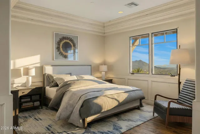 a kitchen with stainless steel appliances granite countertop a sink a stove and a wooden floor