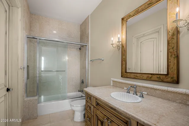 a kitchen with stainless steel appliances granite countertop a sink a stove and a granite counter tops