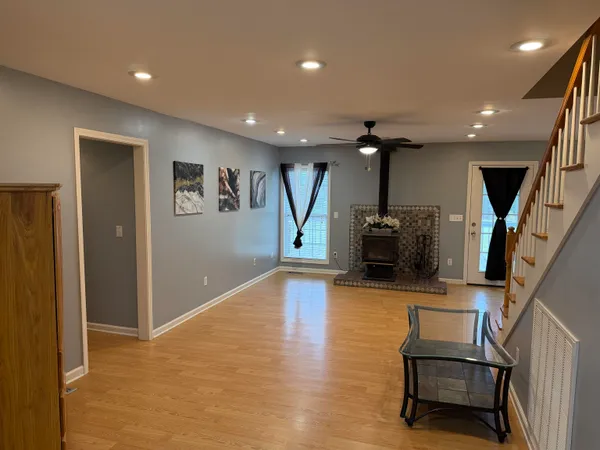 a view of a livingroom with furniture and a flat screen tv