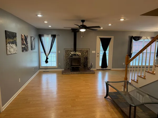 a view of a lobby with furniture and wooden floor