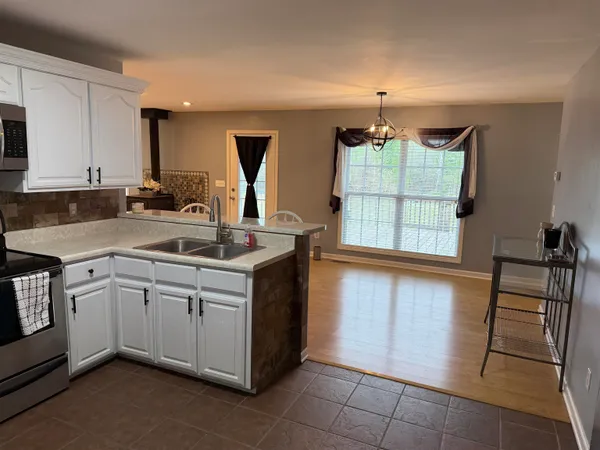 a kitchen with a sink and cabinets
