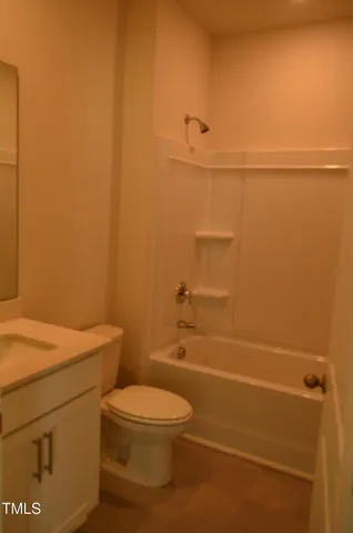 a bathroom with a toilet a sink and shower