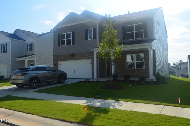 a house view with a garden space