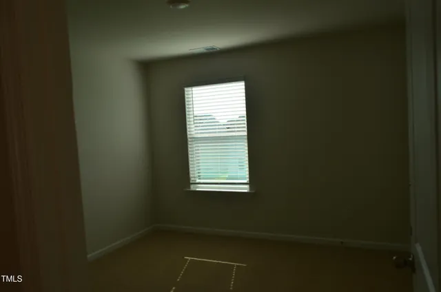 a view of a room that has a window in it
