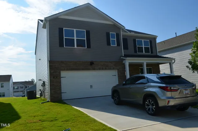 a car parked in front of a house