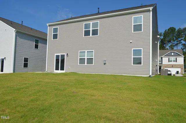 a house that has a big yard in front of it