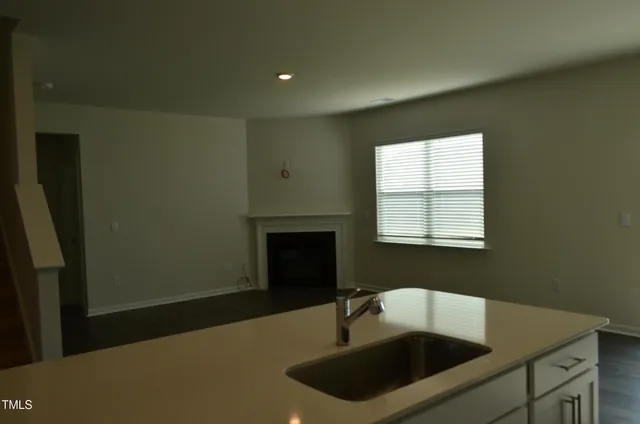 a bathroom with a sink and a window