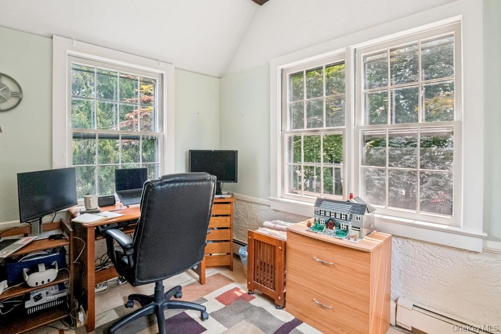 312 Quaker Road Chappaqua, NY 10514 - Photo 28 of 36 a view of a workspace with furniture and a window
