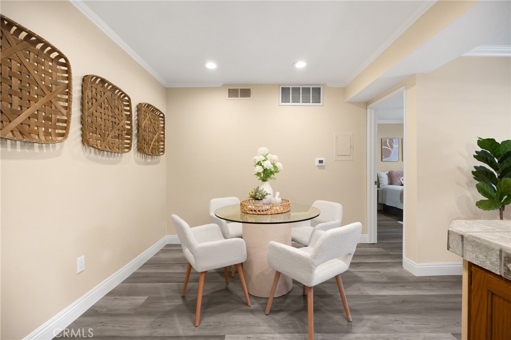 3020 Associated Road, Unit 110 Fullerton, CA 92835 - Photo 20 of 34 a dining room with furniture and wooden floor