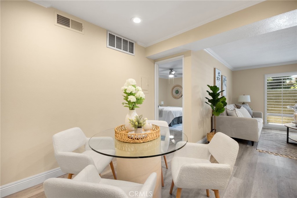3020 Associated Road, Unit 110 Fullerton, CA 92835 - Photo 21 of 34 a living room with furniture and a potted plant