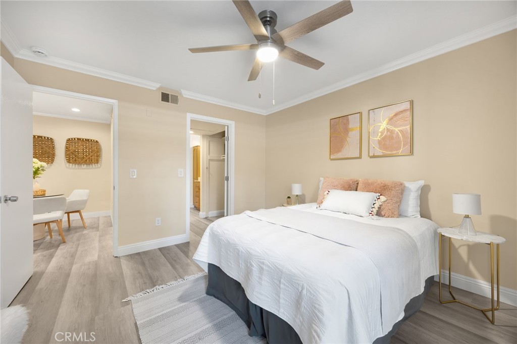 3020 Associated Road, Unit 110 Fullerton, CA 92835 - Photo 26 of 34 a bedroom with a bed and a chandelier