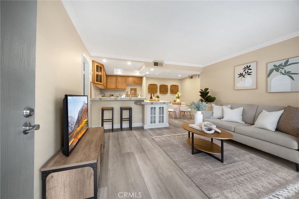 3020 Associated Road, Unit 110 Fullerton, CA 92835 - Photo 27 of 34 a living room with furniture and a flat screen tv