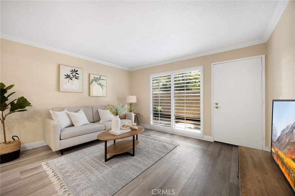3020 Associated Road, Unit 110 Fullerton, CA 92835 - Photo 29 of 34 a living room with furniture and a window