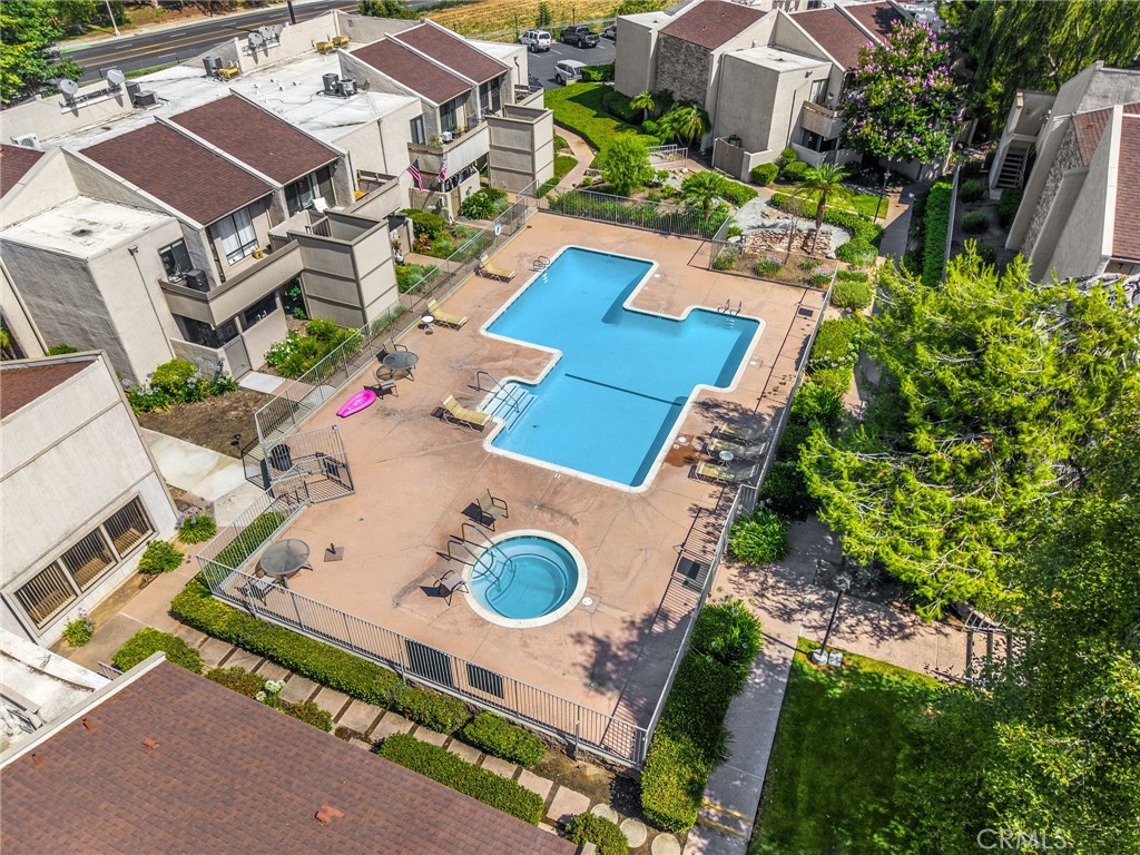 3020 Associated Road, Unit 110 Fullerton, CA 92835 - Photo 32 of 34 an aerial view of residential house with outdoor space and parking