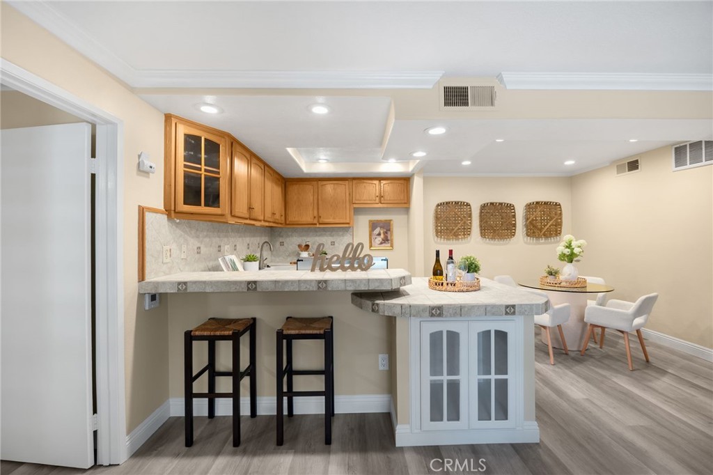 3020 Associated Road, Unit 110 Fullerton, CA 92835 - Photo 4 of 34 a kitchen with stainless steel appliances granite countertop a stove and a refrigerator
