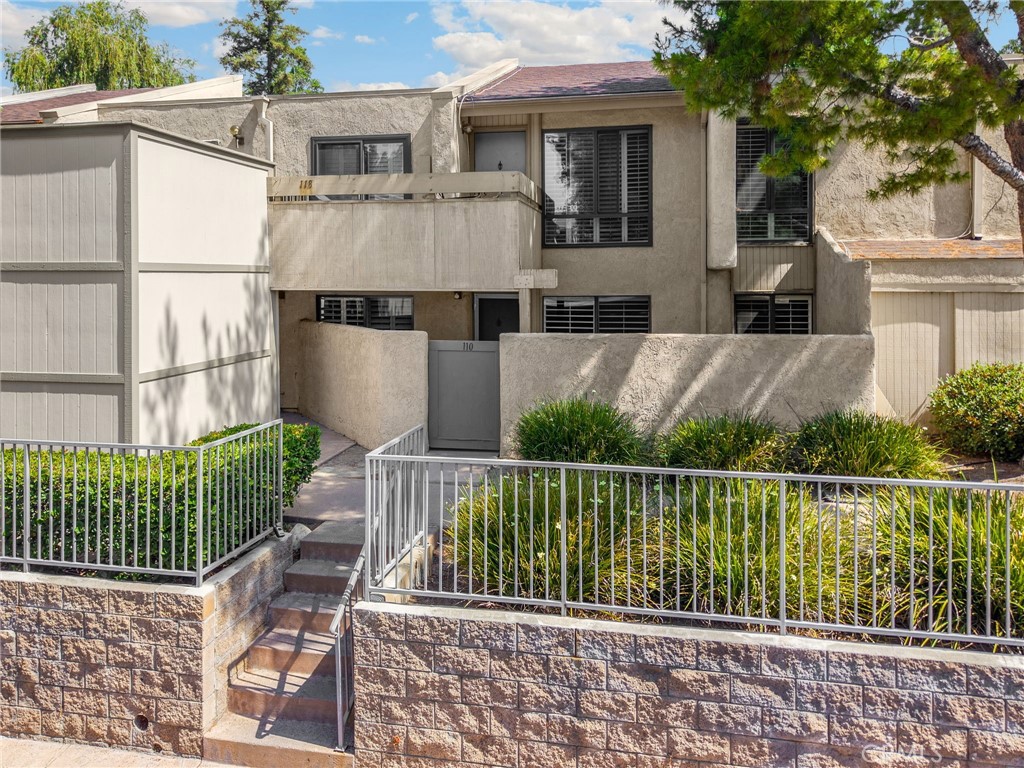 3020 Associated Road, Unit 110 Fullerton, CA 92835 - Photo 8 of 34 a view of house and outdoor space with swimming pool