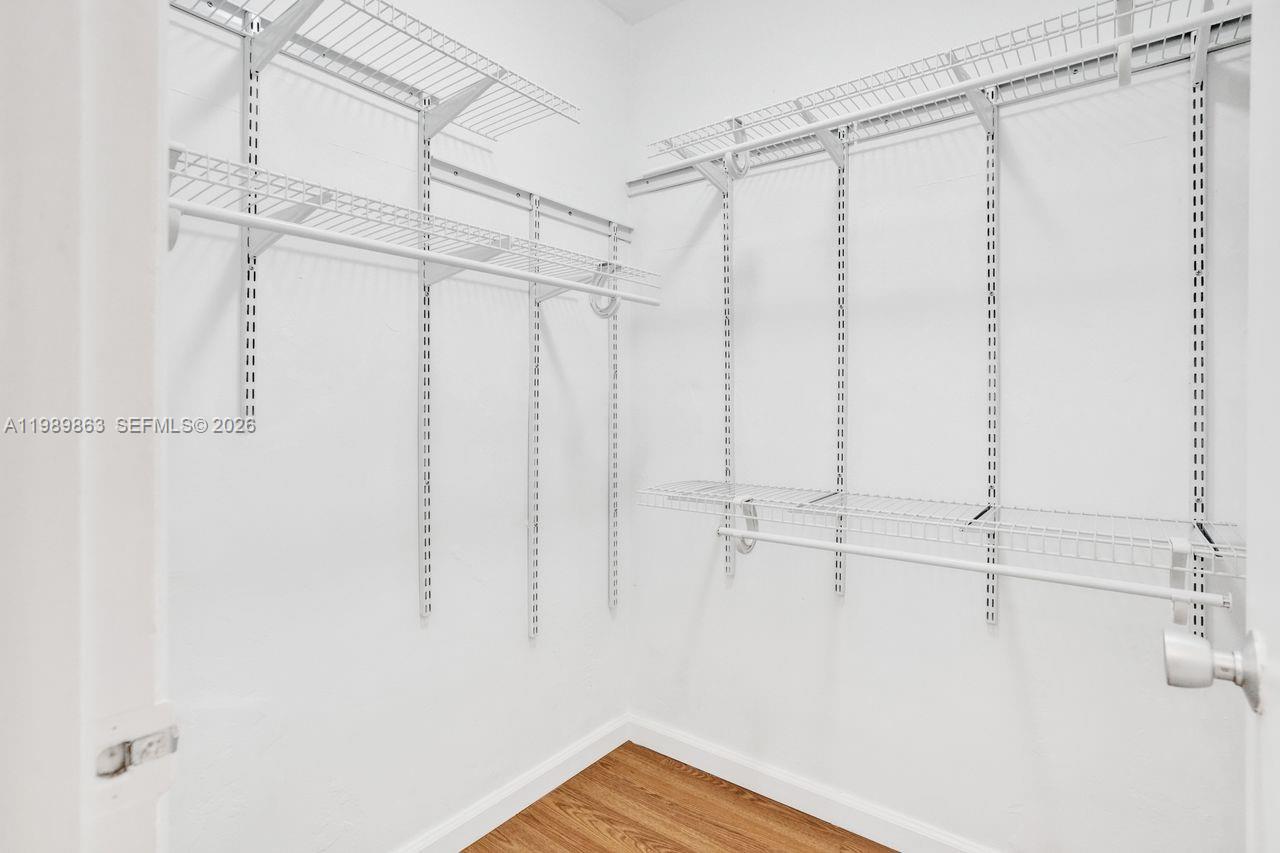 9454 Southwest 77th Avenue, Unit S1 Miami, FL 33156 - Photo 13 of 20 a view of walk in closet