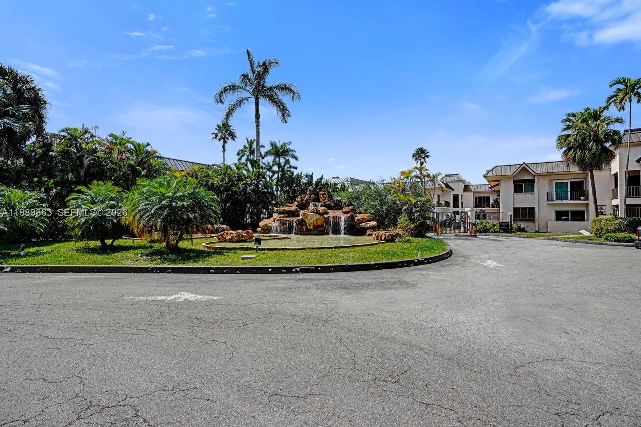 9454 Southwest 77th Avenue, Unit S1 Miami, FL 33156 - Photo 20 of 20 a view of a street with a houses park