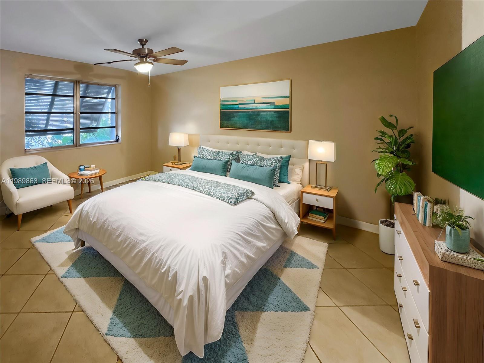 9454 Southwest 77th Avenue, Unit S1 Miami, FL 33156 - Photo 9 of 20 a bed room with a bed window and a flat screen tv