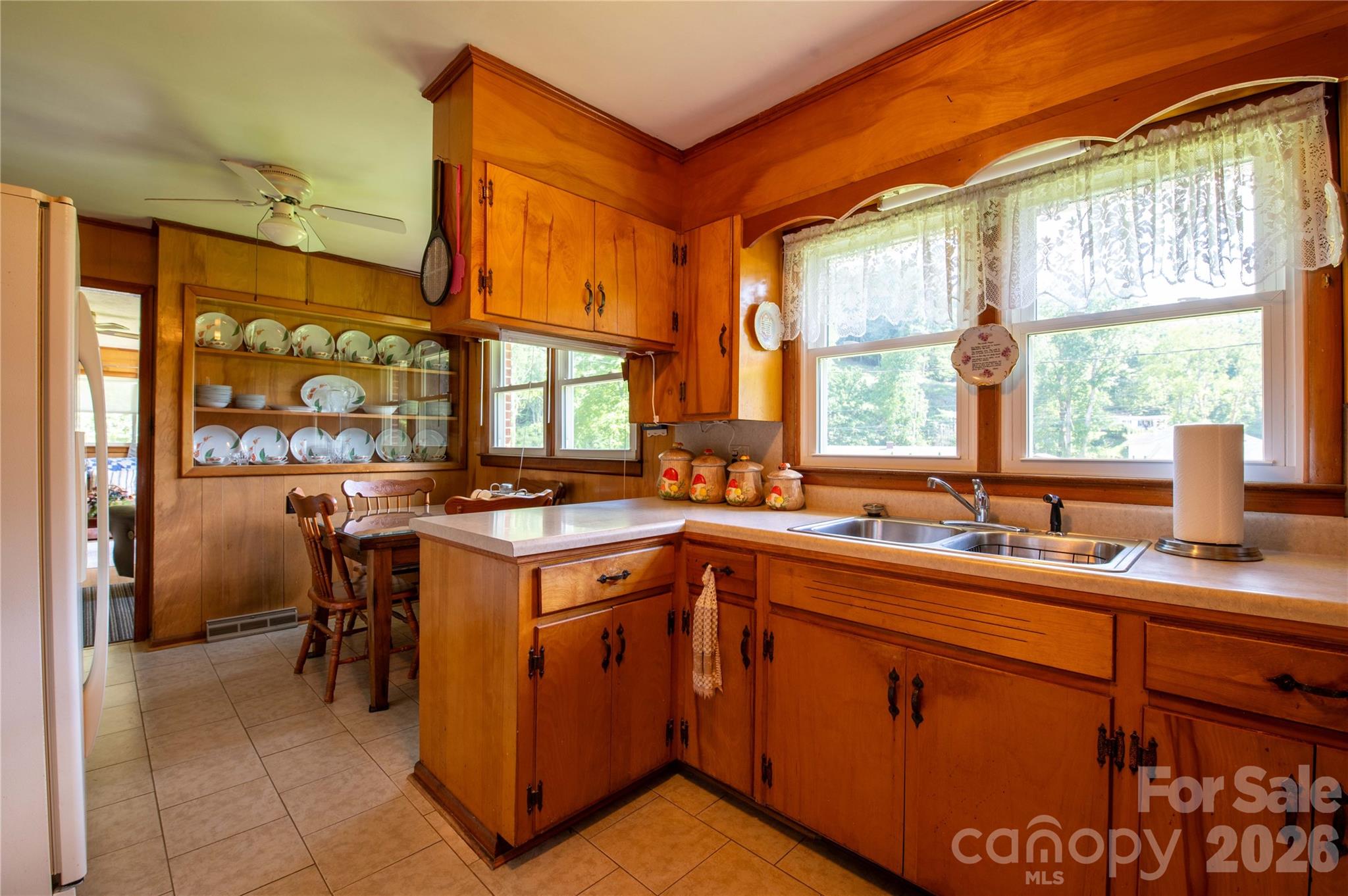 40 Double Island Road Burnsville, NC 28714 - Photo 15 of 38 a kitchen with a sink stove and cabinets