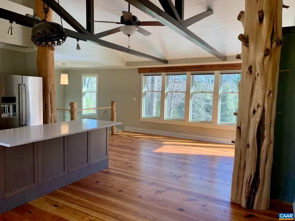 a view of an entryway with wooden floor and door
