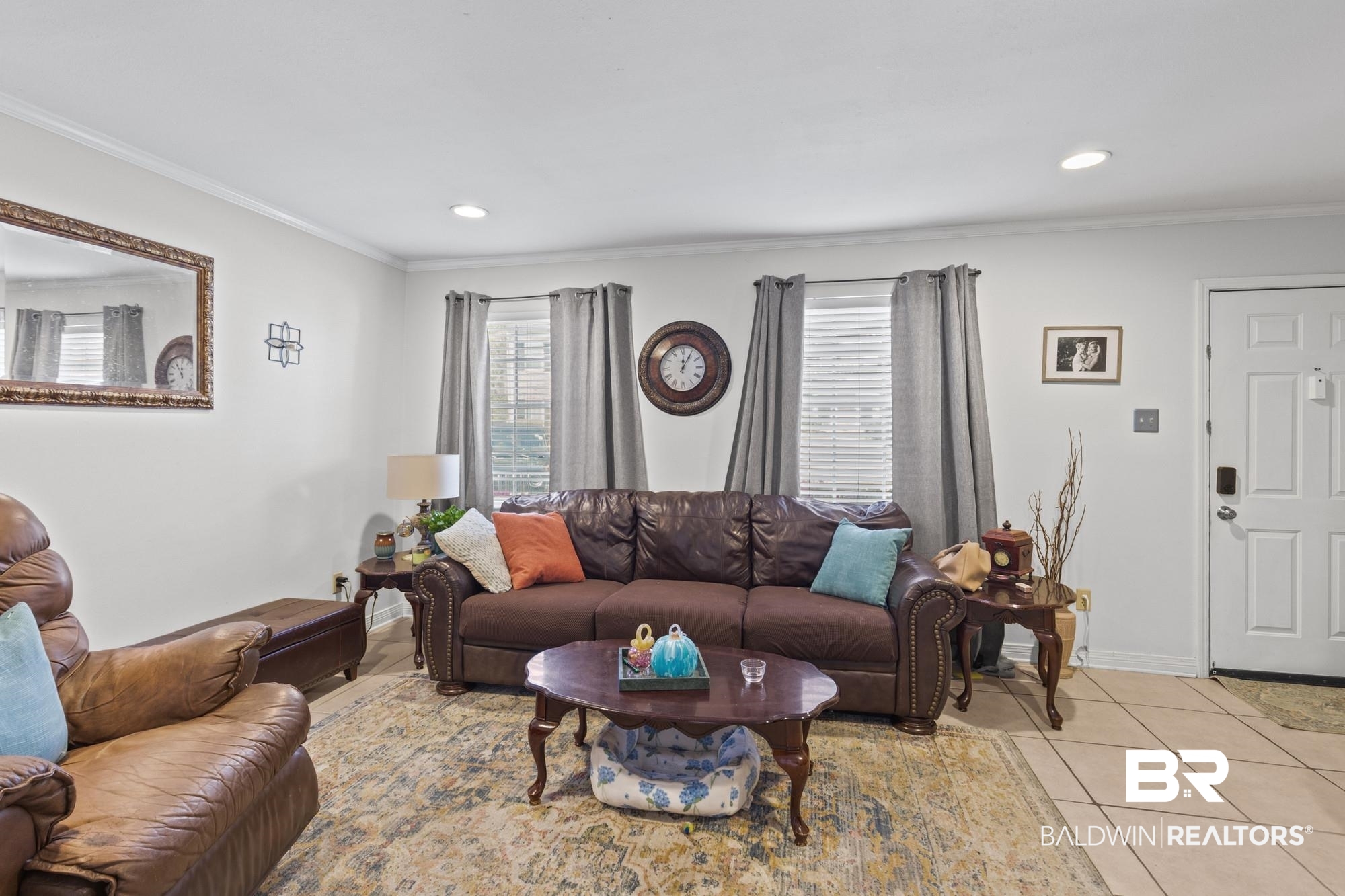 114 Du Rhu Drive, Unit A Mobile, AL 36608 - Photo 3 of 14 Living area with crown molding, healthy amount of natural light, light tile patterned floors, and recessed lighting