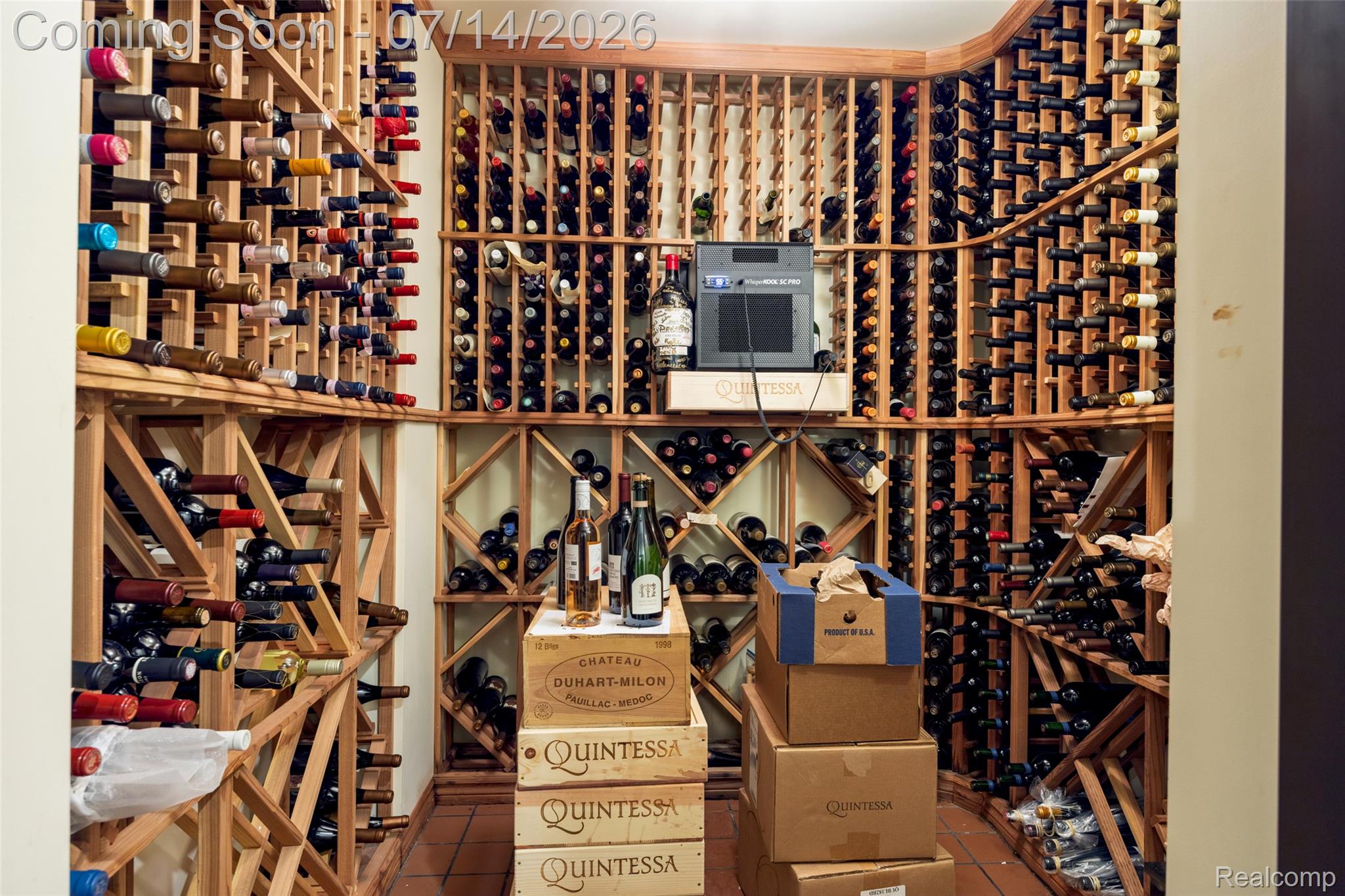 189 Cloverly Road Grosse Pointe, MI 48236 - Photo 66 of 96 Dedicated wine cellar featuring extensive wood racking, a built-in cooling unit, and terracotta tile flooring