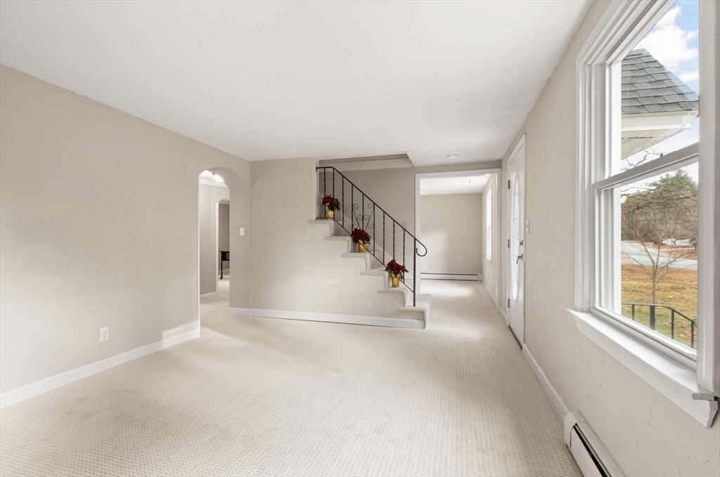 319 Pleasant Street Dunstable, MA 01827 - Photo 12 of 36 a view of entryway and hall with a window