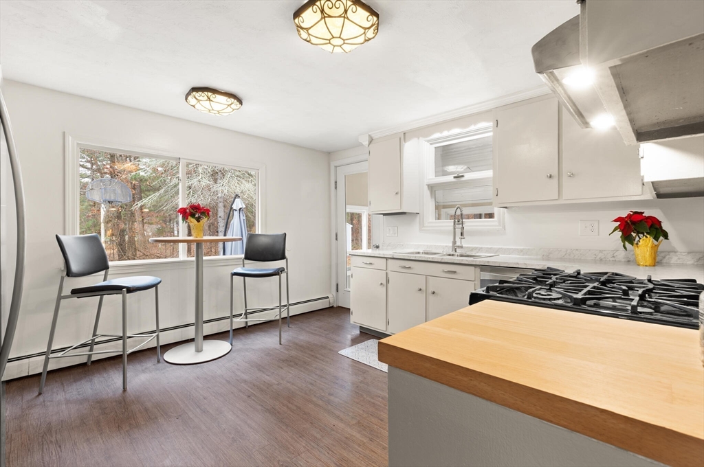 319 Pleasant Street Dunstable, MA 01827 - Photo 15 of 36 a kitchen with a sink appliances and cabinets