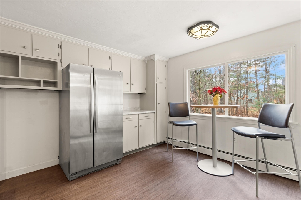 319 Pleasant Street Dunstable, MA 01827 - Photo 18 of 36 a kitchen with a refrigerator and furniture