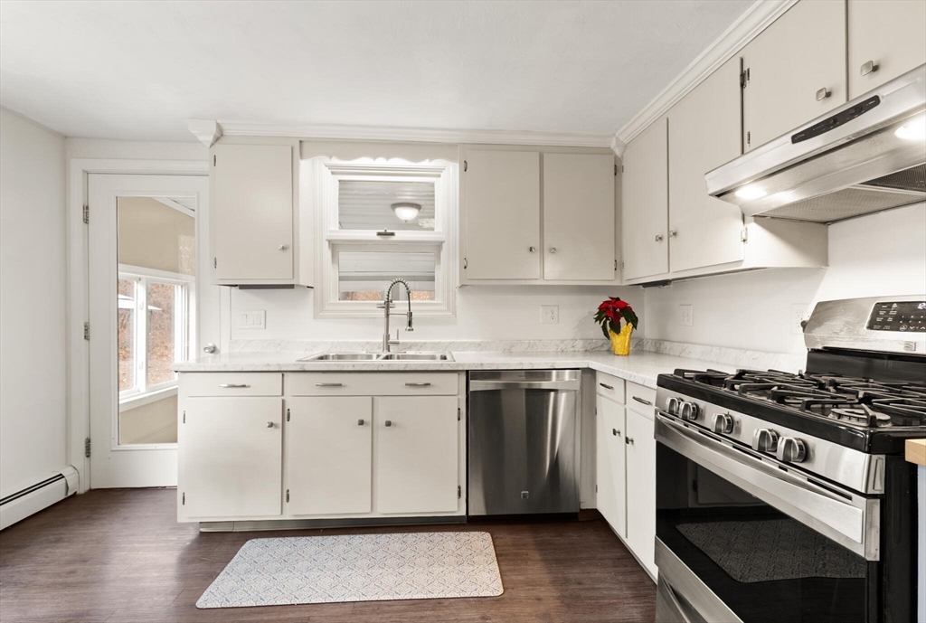 319 Pleasant Street Dunstable, MA 01827 - Photo 20 of 36 a kitchen with stainless steel appliances granite countertop a stove and a sink