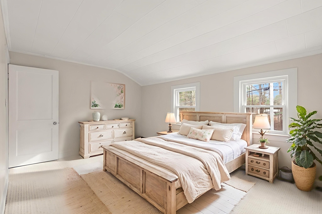 319 Pleasant Street Dunstable, MA 01827 - Photo 26 of 36 a bed room with a bed and a potted plant