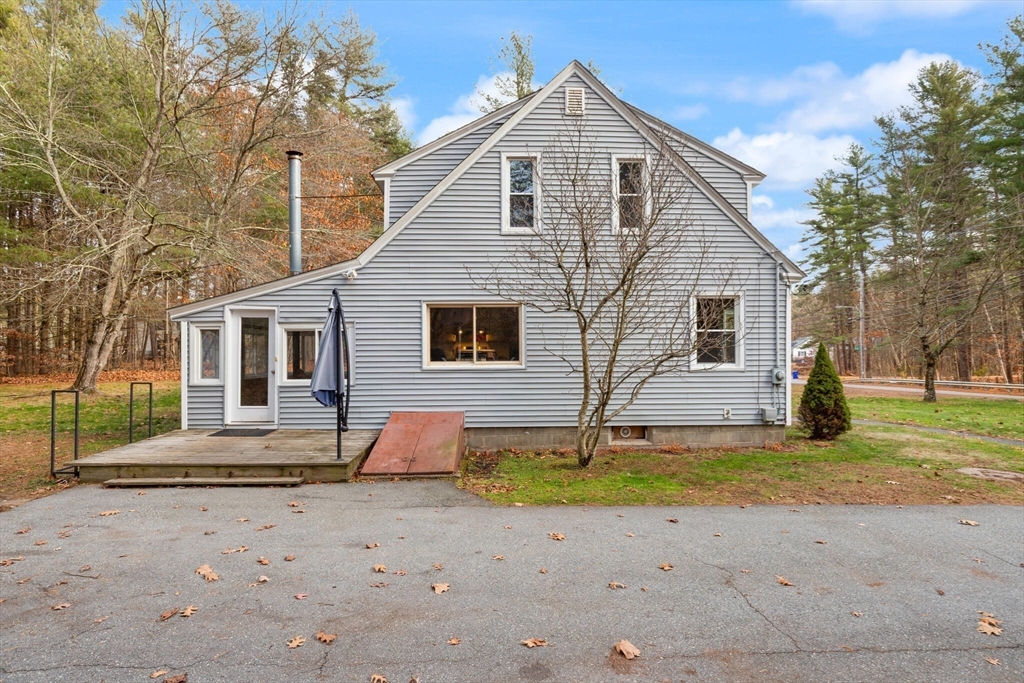 319 Pleasant Street Dunstable, MA 01827 - Photo 34 of 36 a front view of a house with a yard