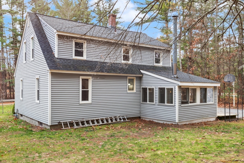 319 Pleasant Street Dunstable, MA 01827 - Photo 35 of 36 a view of a house with a yard